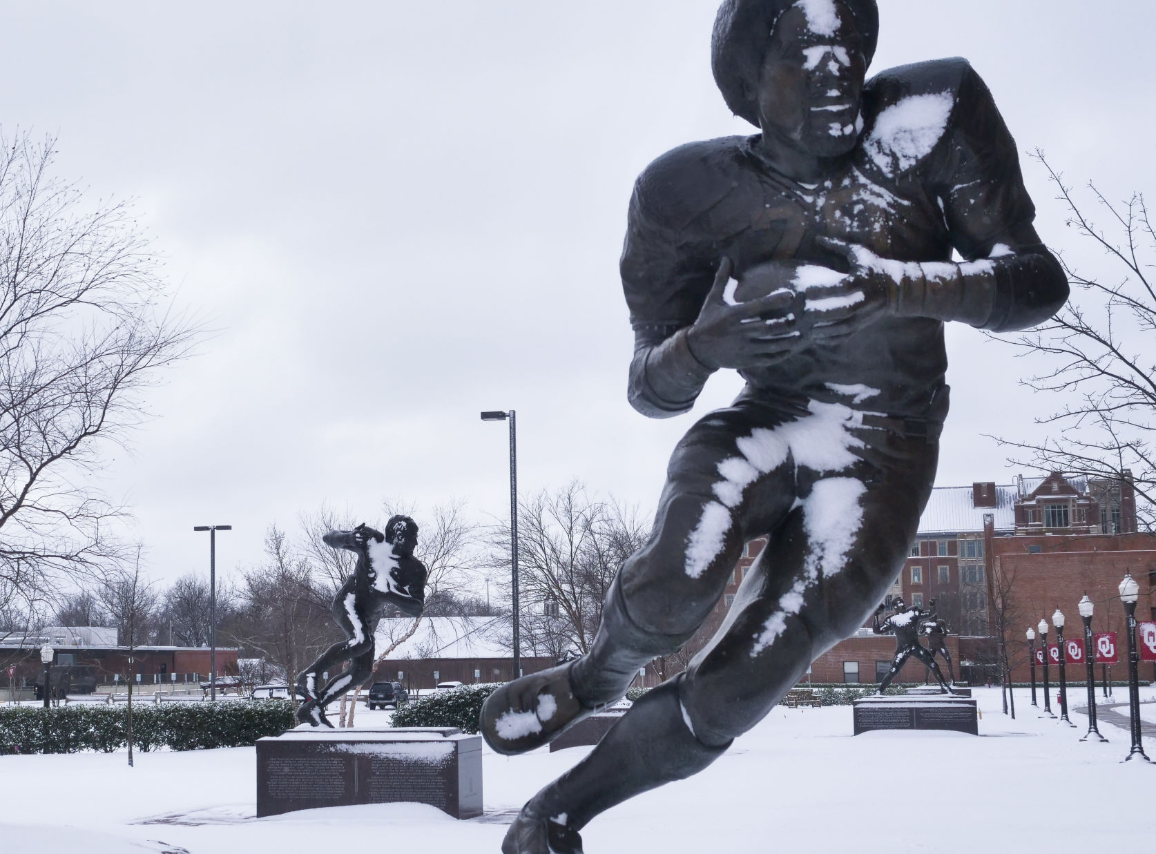 Heisman statues in snow
